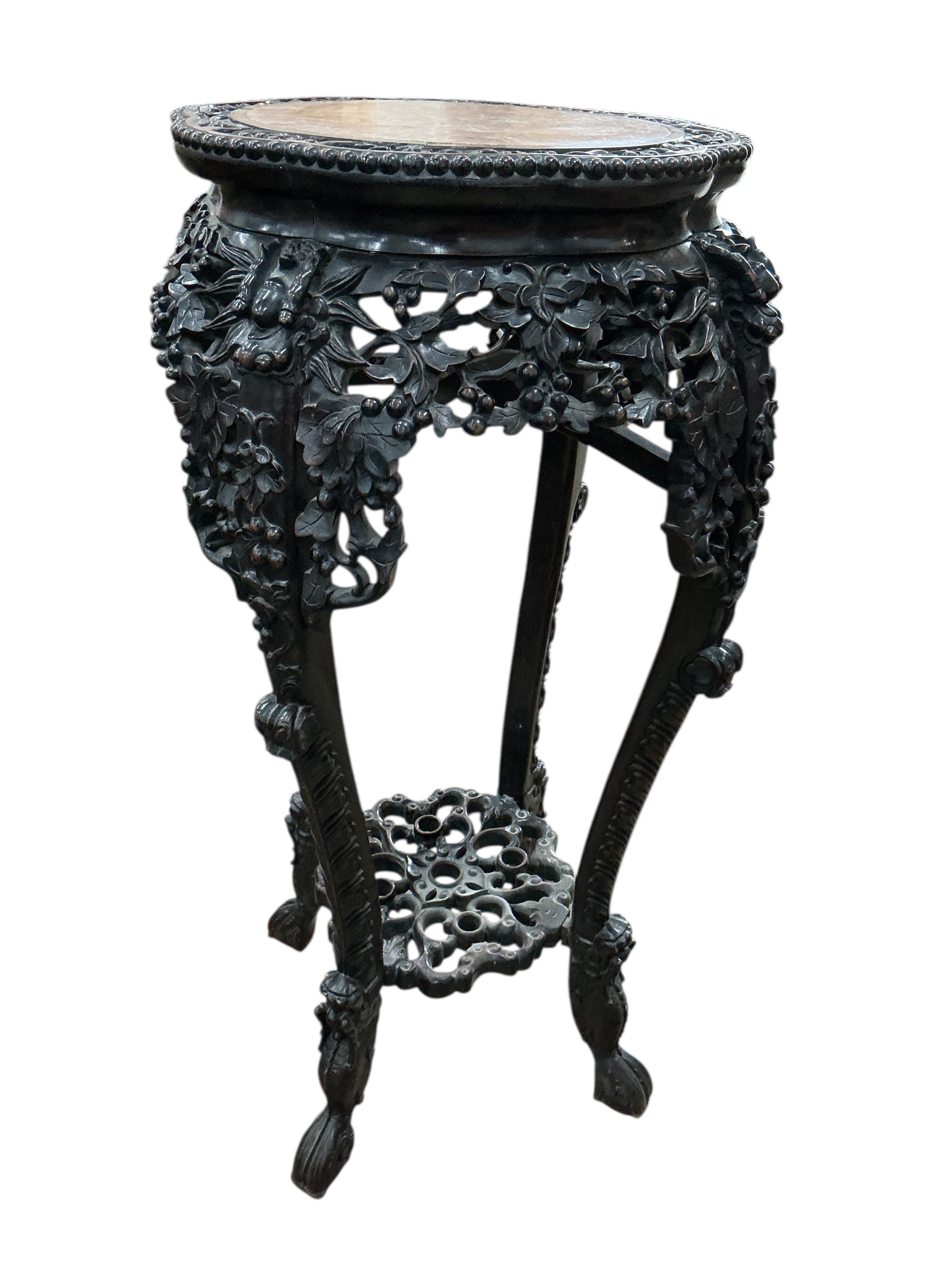 A Chinese carved hongmu rouge marble topped vase stand, diameter 42cm, height 93cm